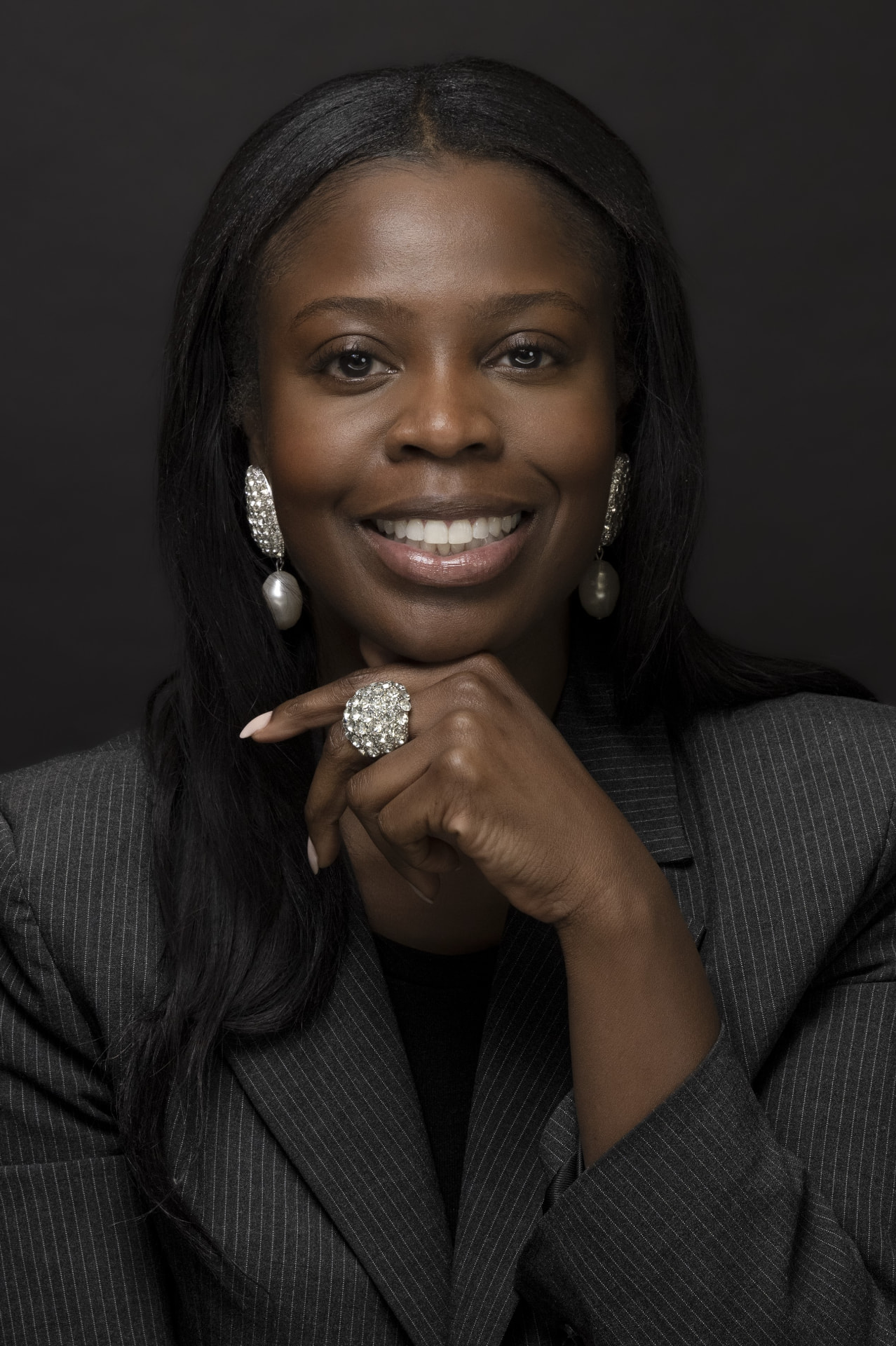 Lionne C. Whitfield in a professional pinstripe jacket